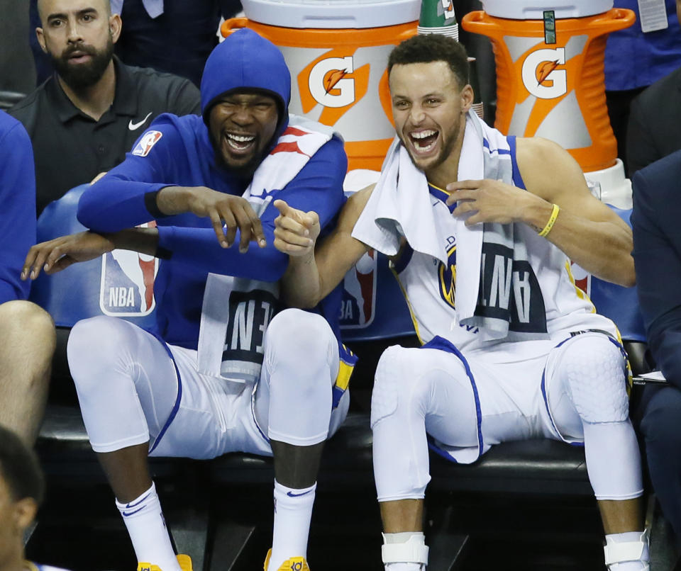 Kevin Durant and Stephen Curry have found the joy in combining their super powers. (AP)