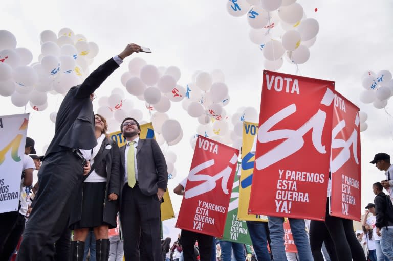 People gather at Bogota's Bolivar main square on September 26, 2016, to celebrate the historic peace agreement