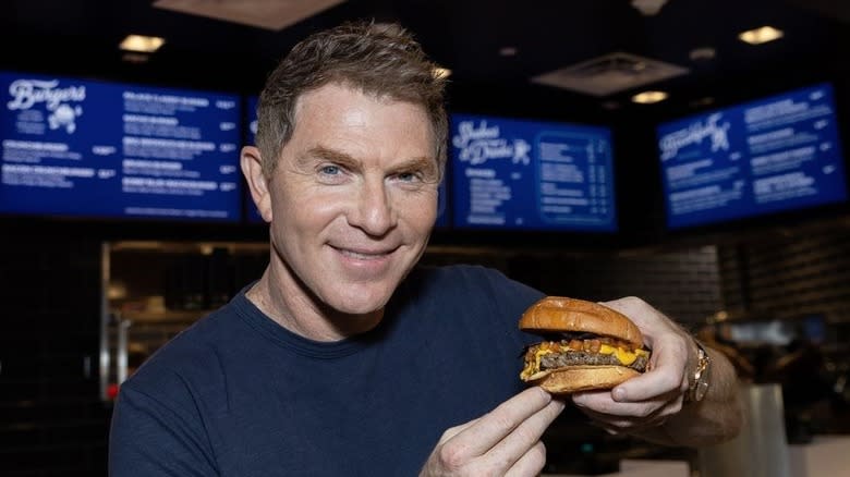 Bobby Flay holding burger