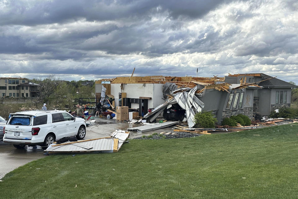 Damage is seen to a home after a tornado passed through the area near Bennington, Neb., Friday, April 26, 2024. (AP Photo/Josh Funk)