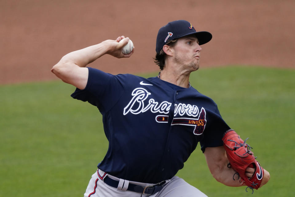 Atlanta Braves starting pitcher Kyle Wright (30) delivers in the first inning of a spring training baseball game against the Minnesota Twins Monday, March 22, 2021, in Fort Myers, Fla. (AP Photo/John Bazemore)