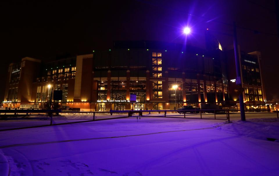 A purple-colored street light on the south side of Lambeau Field in Green Bay.