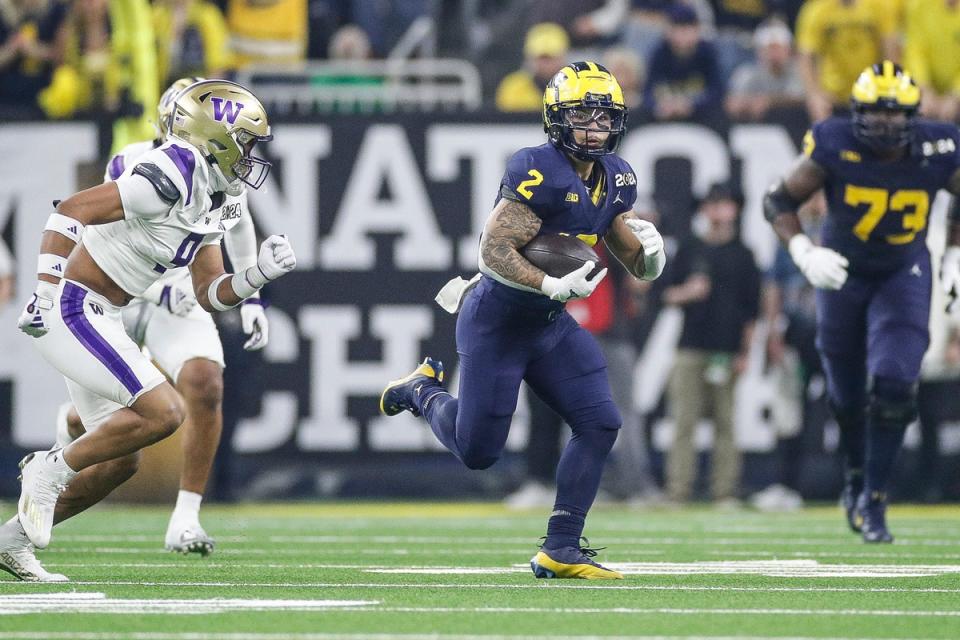 Michigan running back Blake Corum runs against Washington during the first half of the national championship game at NRG Stadium in Houston, Texas on Monday, Jan. 8, 2024.