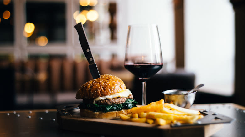 Wine, burger, and fries