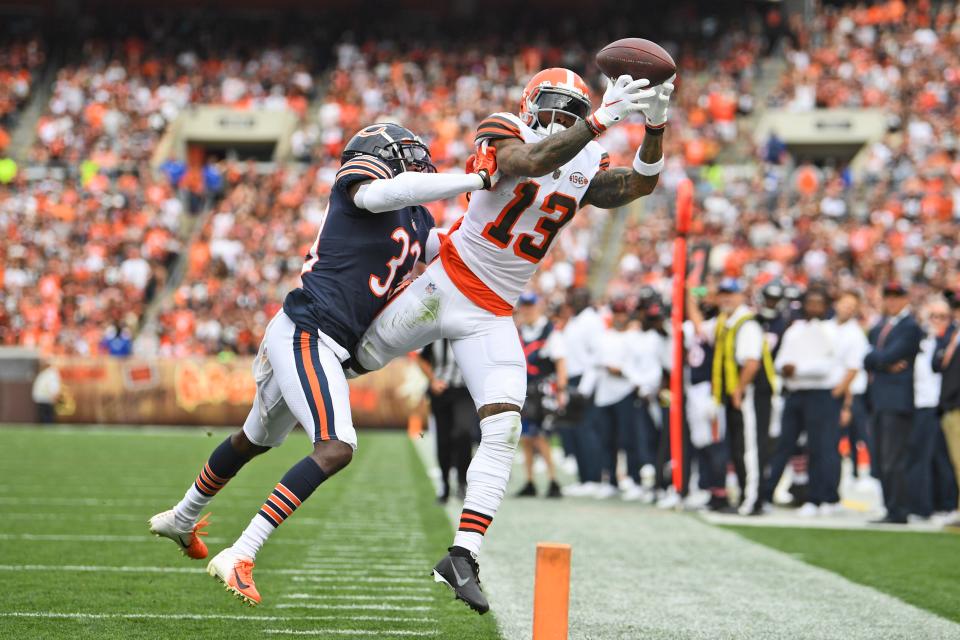 Cleveland Browns wide receiver Odell Beckham Jr. (13) canno hold onto the ball as Chicago Bears cornerback Jaylon Johnson (33) knocks him out of bounds for an incompletion during the second half of an NFL football game, Sunday, Sept. 26, 2021, in Cleveland. (AP Photo/David Dermer)