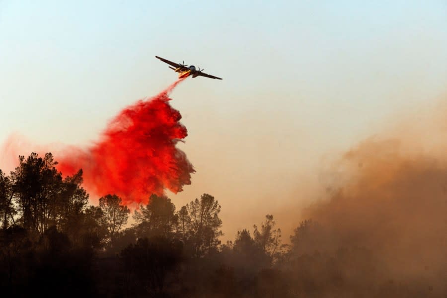 An air tanker drops retardant while battling the Aero Fire in the Copperopolis community of Calaveras County, Calif., on Monday, June 17, 2024. (AP Photo/Noah Berger)
