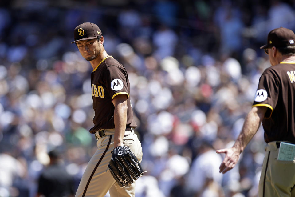 San Diego Padres pitcher Yu Darvish looks back to manager Bob Melvin before being taken out of the game against the New York Yankees during the third inning of a baseball game ,Sunday, May 28, 2023, in New York. (AP Photo/Adam Hunger)
