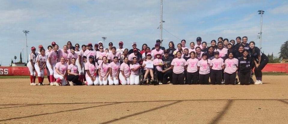 Ceres and Pacheco JV and varsity players and coaches take a photo with those affected by cancer before games on Thursday, April 25, 2024 at Ceres High School. Five representatives threw out pregame first pitches.