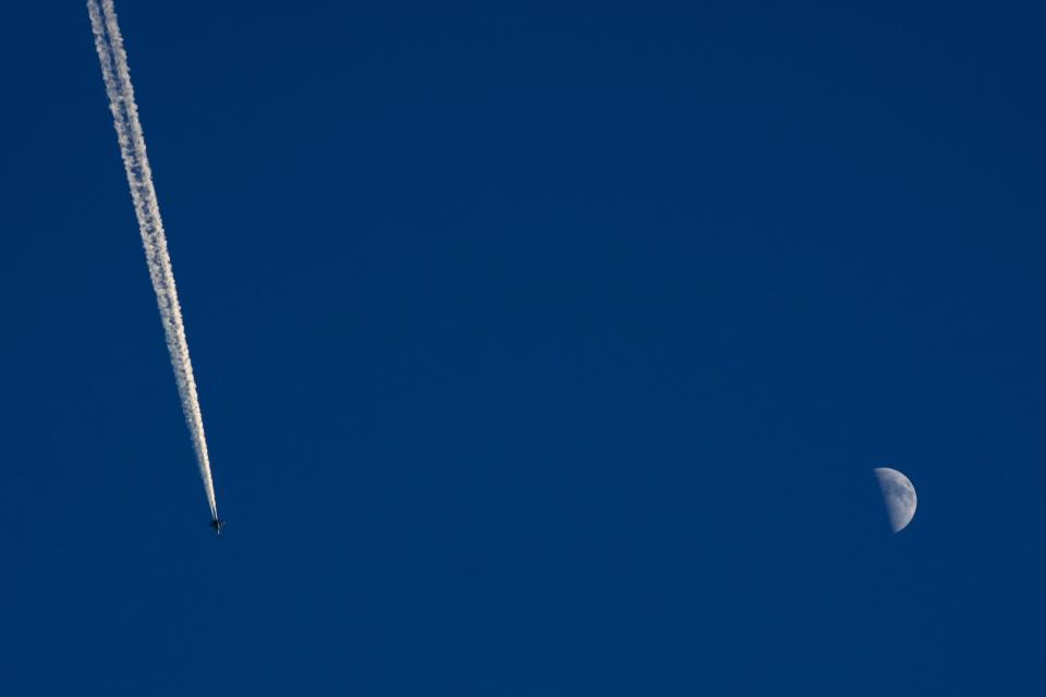 A military plane flies above the Taiwan Strait as seen from the 68-nautical-mile scenic spot, the closest point in mainland China to the island of Taiwan, in Pingtan in southeastern China's Fujian Province, Friday, Aug. 5, 2022 (AP)