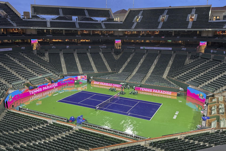 An empty court is seen at the BNP Paribas Open tennis tournament as play is halted for rain, Wednesday, March 6, 2024, in Indian Wells, Calif. (AP Photo/Mark J. Terrill)