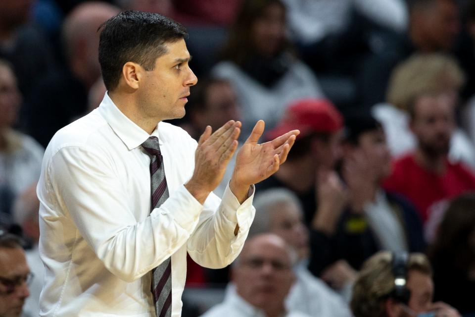 Cincinnati Bearcats head coach Wes Miller claps in the second half of the NCAA men's basketball game on Saturday, Nov. 13, 2021, at Fifth Third Arena in Cincinnati. Cincinnati Bearcats defeated Georgia Bulldogs 73-68.