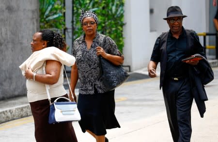 Visitors arrive at funeral parlour Singapore Casket, where the body of late former Zimbabwe's President Robert Mugabe is being held in Singapore