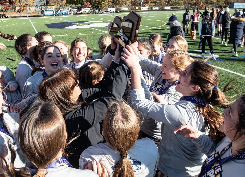 Mamaroneck celebrates after defeating Orchard Park 4-0 to win the New York State Class A Field Hockey championship at Centereach High School on Long Island Nov. 12, 2023.