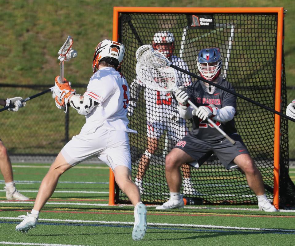 Mamaroneck's Rhett Chambers scores past North Rockland goalie Kevin Devine during their Section 1 Class A semifinal at Mamaroneck May 26, 2023. Mamaroneck won 12-7.