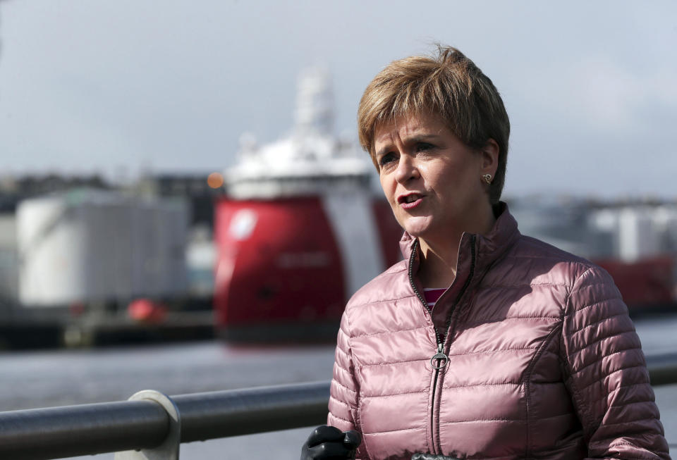 First Minister of Scotland and leader of the SNP Nicola Sturgeon, visits Pocra Quay during campaigning for the Scottish Parliamentary election, in Aberdeen, Scotland, Wednesday, May 5, 2021. Scotland holds an election Thursday that could hasten the breakup of the United Kingdom. The pro-independence Scottish National Party is leading in the polls and a big victory will give it the the moral right and the political momentum to hold a referendum on whether Scotland should end its three-century union with England. First Minister Nicola Sturgeon has downplayed independence in her campaign, stressing her credentials as a safe pair of hands to lead Scotland’s recovery from the pandemic. (Russell Cheyne/PA via AP)