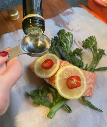 A drizzle of olive oil and some salt and pepper are all that is needed beyond salmon, lemon, chilies and broccolini. (Photo: Aly Walansky)