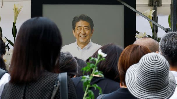 PHOTO: People gather to offer flowers at Zojoji Temple, where the funeral of late former Japanese Prime Minister Shinzo Abe is being held, in Tokyo, Japan July 12, 2022. (Kim Kyung-hoon/Reuters)