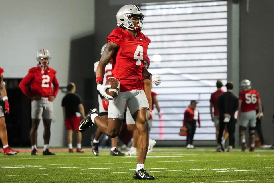 Mar 7, 2024; Columbus, OH, USA; Ohio State Buckeyes wide receiver Jeremiah Smith (4) returns a punt during spring football practice at the Woody Hayes Athletic Center.