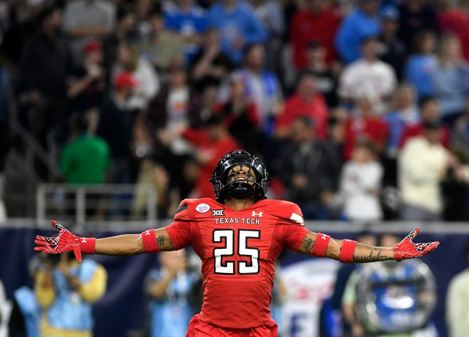 Texas Tech's defensive back Dadrion Taylor-Demerson (25) celebrates his interception against Mississippi.