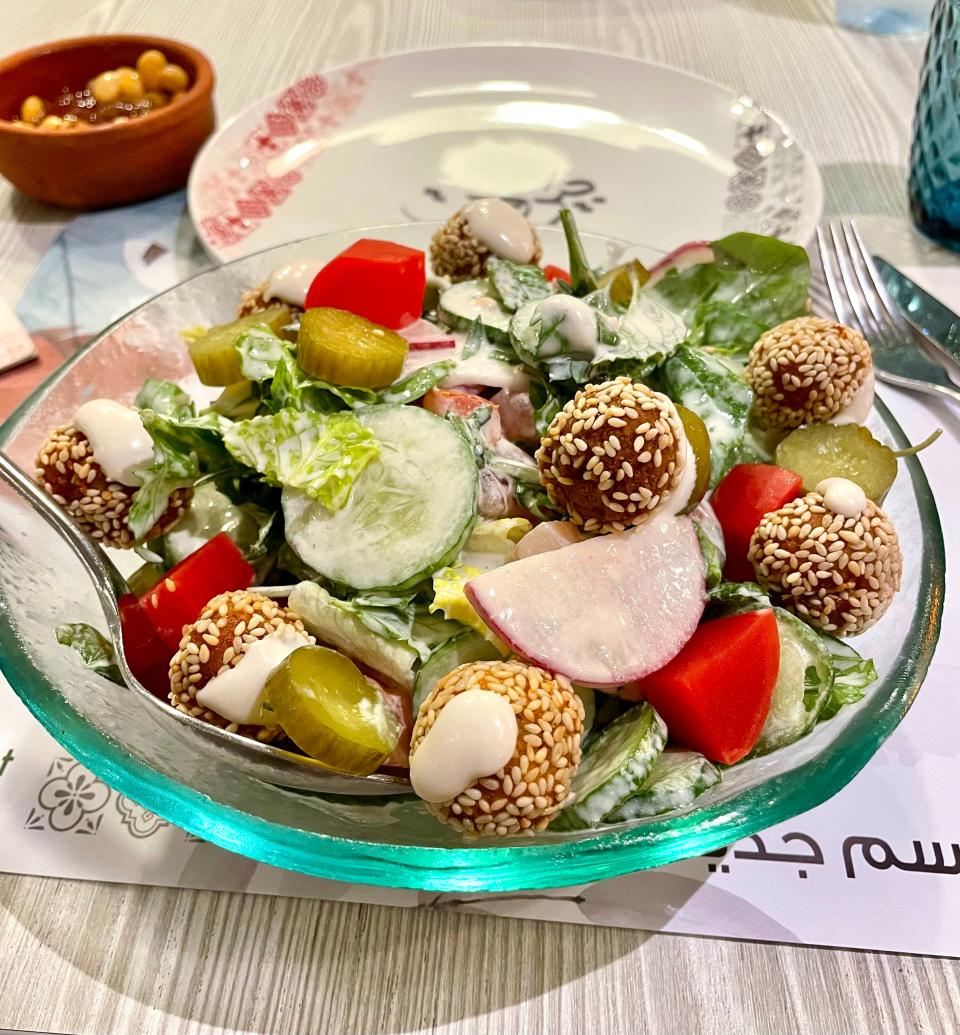 Falafel salad with cucumbers and pickled vegetables