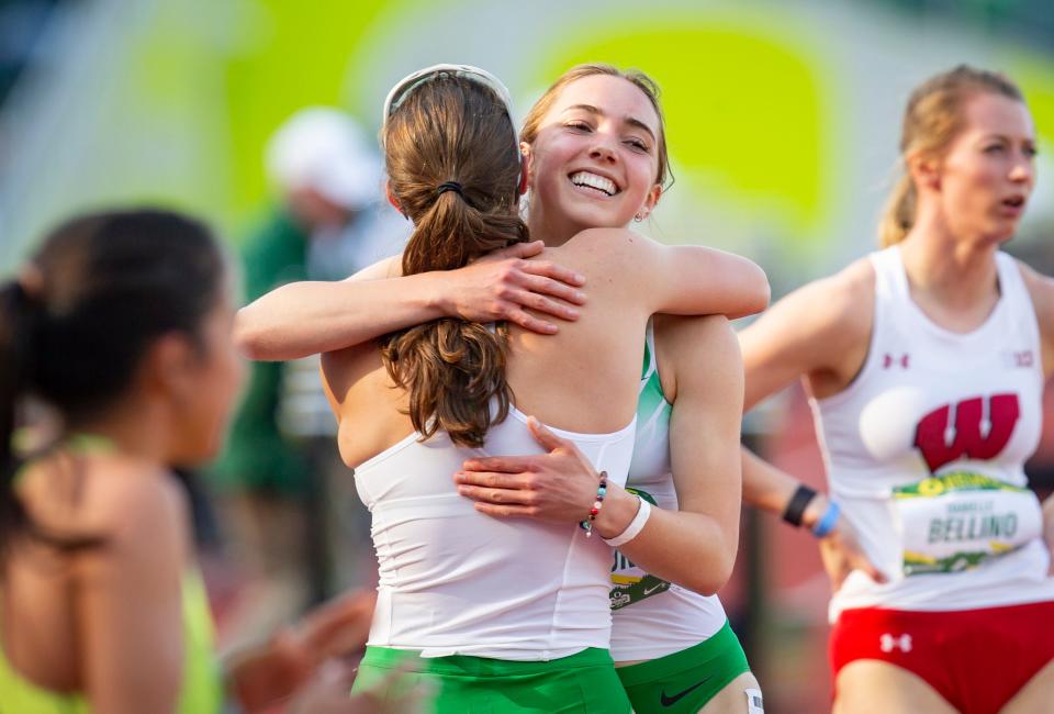 Oregon's Ella Nelson, right, embraces teammate Izzy Thornton-Bott at the finish line of the women's 800 meter run at the Oregon Relays Saturday, April 23, 2022, at Hayward Field. Nelson finished second with a time of 2:06.66.