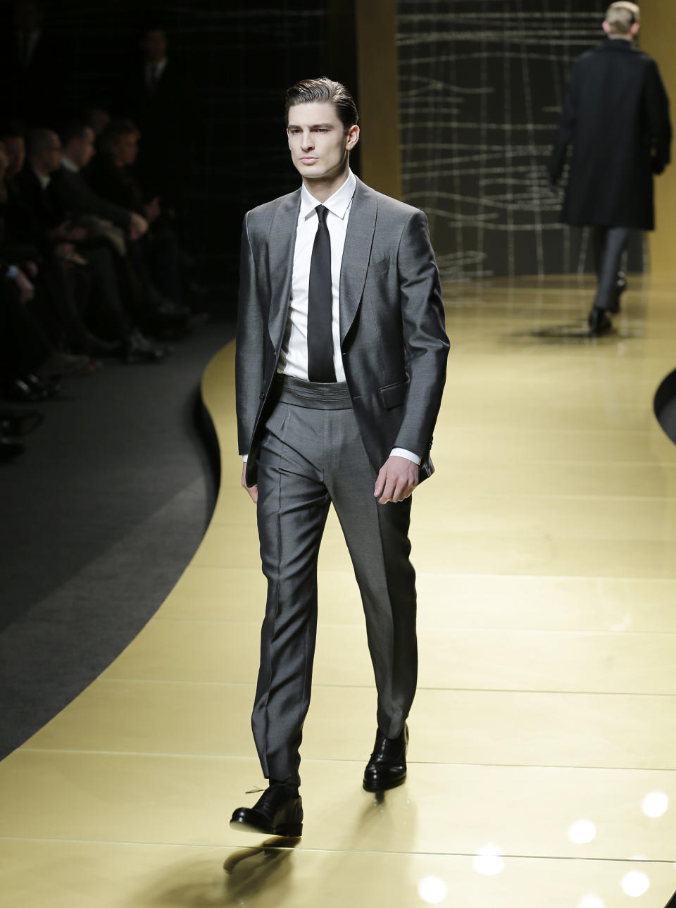 A model wears a creation of Ermenegildo Zegna men's Fall-Winter 2013-14 collection, part of the Milan Fashion Week, unveiled in Milan, Italy, Saturday, Jan. 12, 2013. (AP Photo/Antonio Calanni)