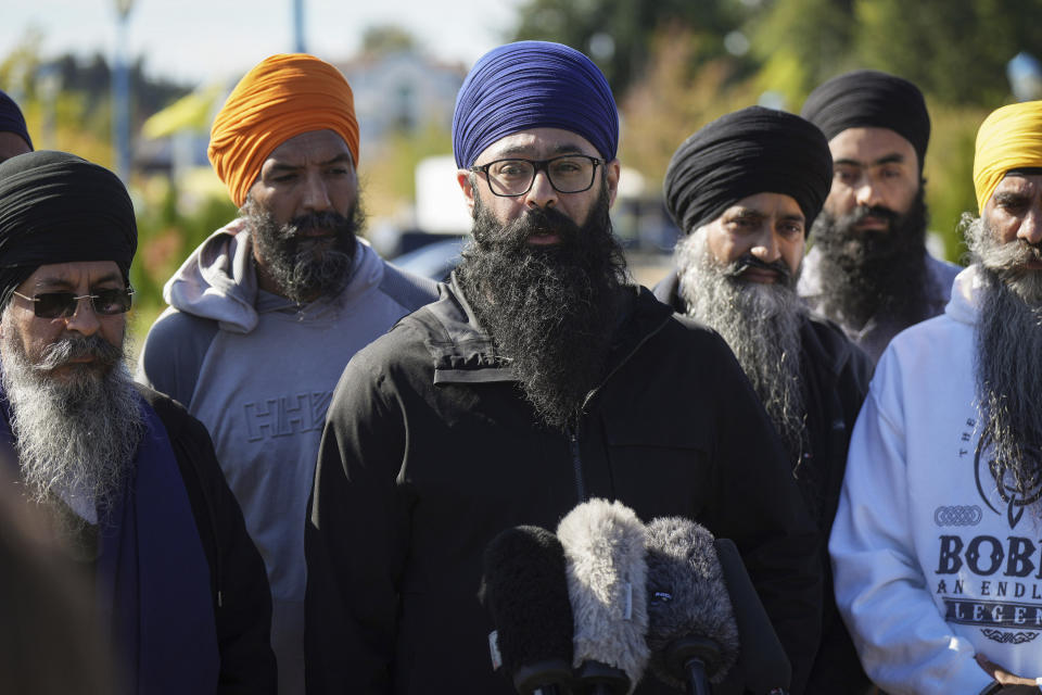 Moninder Singh, center, a spokesperson for the British Columbia Gurdwaras Council (BCGC), speaks to reporters outside the Guru Nanak Sikh Gurdwara Sahib in Surrey, British Columbia, on Monday, Sept. 18, 2023, where temple president Hardeep Singh Nijjar was gunned down in his vehicle while leaving the temple parking lot in June. Canada expelled a top Indian diplomat Monday as it investigates what Prime Minister Justin Trudeau called credible allegations that India’s government may have had links to the assassination in Canada of a Sikh activist.(Darryl Dyck/The Canadian Press via AP)