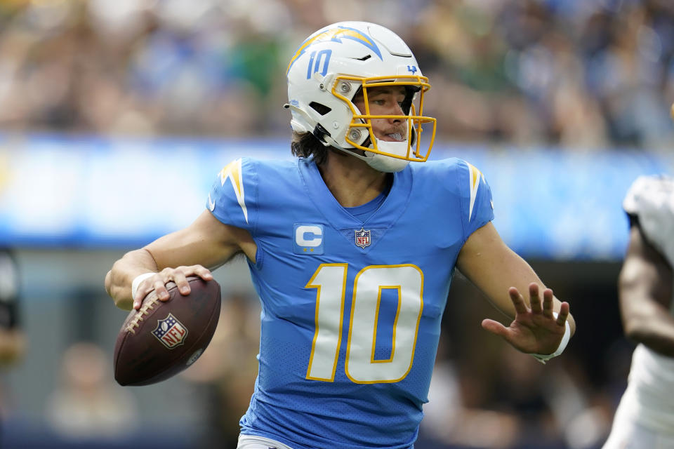 Los Angeles Chargers quarterback Justin Herbert (10) passes against the Jacksonville Jaguars during the first half of an NFL football game in Inglewood, Calif., Sunday, Sept. 25, 2022. (AP Photo/Marcio Jose Sanchez)