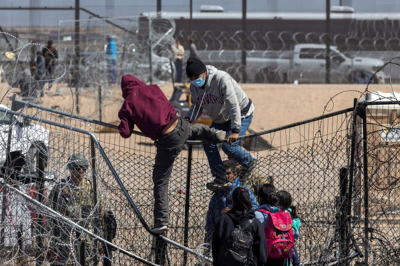 Migrants cross into the U.S. as seen from Ciudad Juarez