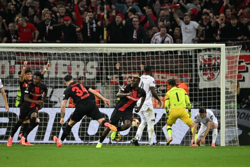 Leverkusen's Victor Boniface (C) celebrates after scoring his side's second goal of the game during the UEFA Europa League quarter-final first leg soccer match between Bayer Leverkusen and West Ham United at BayArena. Federico Gambarini/dpa