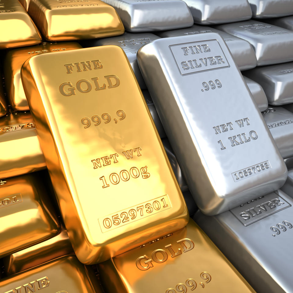 Gold and silver bars side by side.