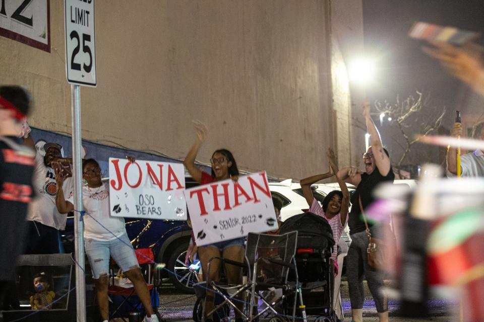 Lori Villarreal, right, cheers for her son in the West Oso marching band during the Buc Days Night Parade on Saturday, May 7, 2022, in Corpus Christi.