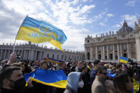 Faithful display Ukrainian flags during Pope Francis' Angelus noon prayer in St. Peter's Square at the Vatican, Sunday, Feb. 27, 2022. (AP Photo/Gregorio Borgia)
