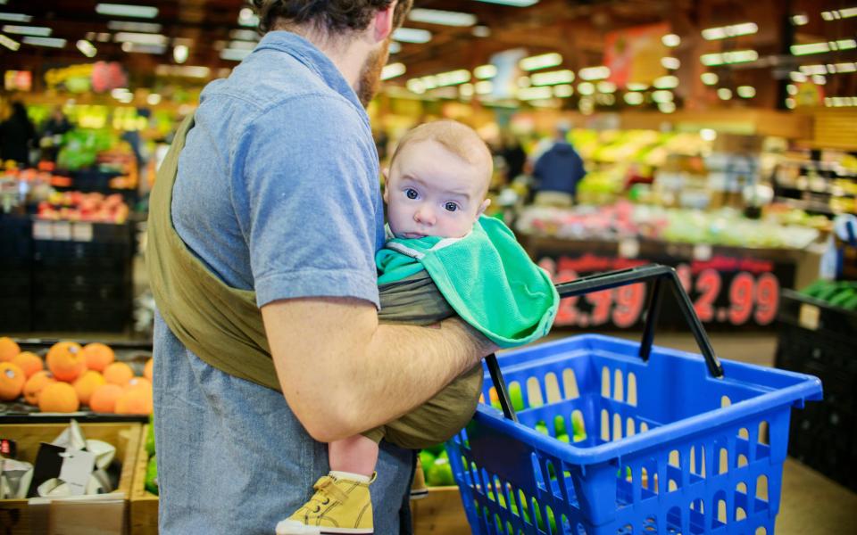 man with baby - Credit: Alamy