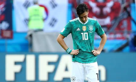 Soccer Football - World Cup - Group F - South Korea vs Germany - Kazan Arena, Kazan, Russia - June 27, 2018 Germany's Mesut Ozil looks dejected after the match REUTERS/Michael Dalder