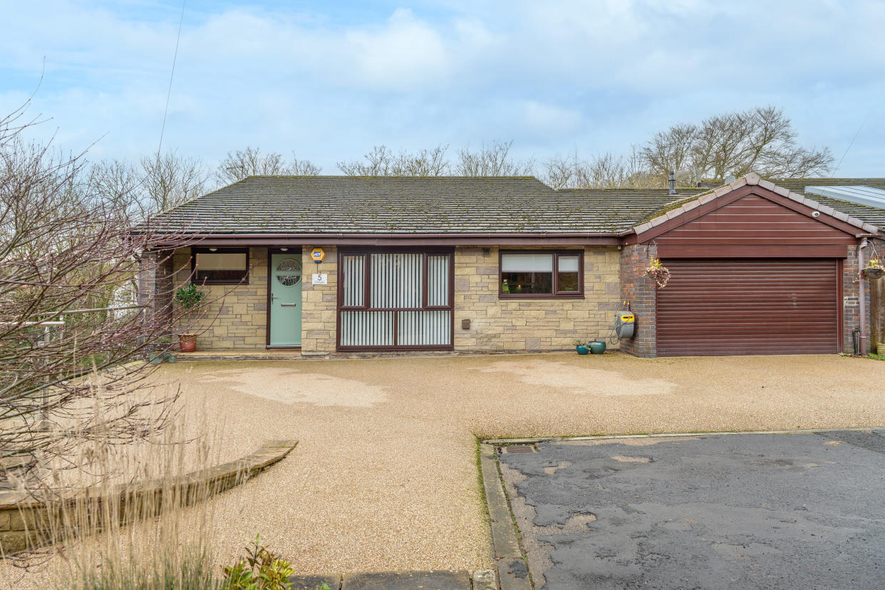 The bungalow looks unassuming from the front. (SWNS)