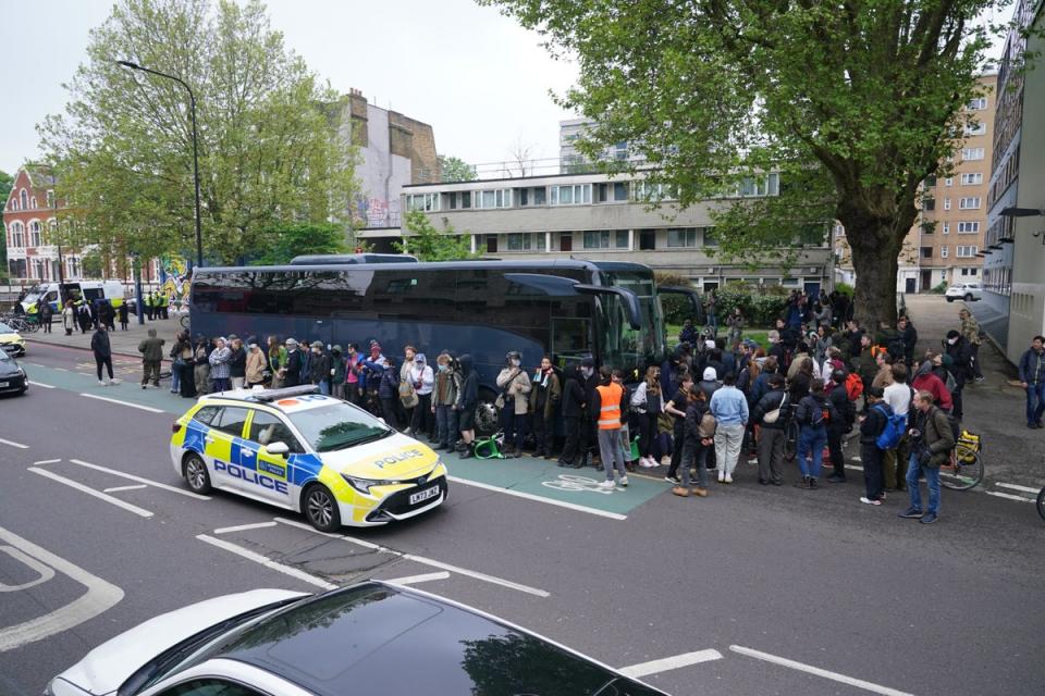 Protesters surround the coach on Thursday morning (PA)