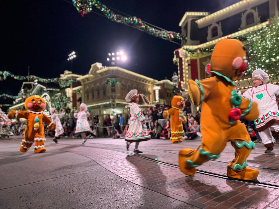 christmas parade going down main street usa at disney