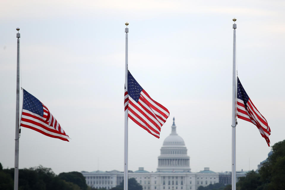 Flags fly at half-staff in Washington after more than 30 people died in mass shootings. (Photo: Win McNamee via Getty Images)