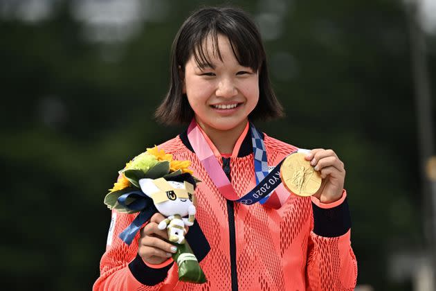 Japan's Momiji Nishiya poses with her gold medal for the skateboarding women's street final of the Tokyo 2020 Olympic Games. (Photo: JEFF PACHOUD via Getty Images)
