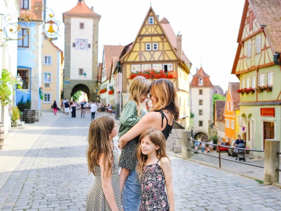 Diana Blinkhorn hugging and holding daughters