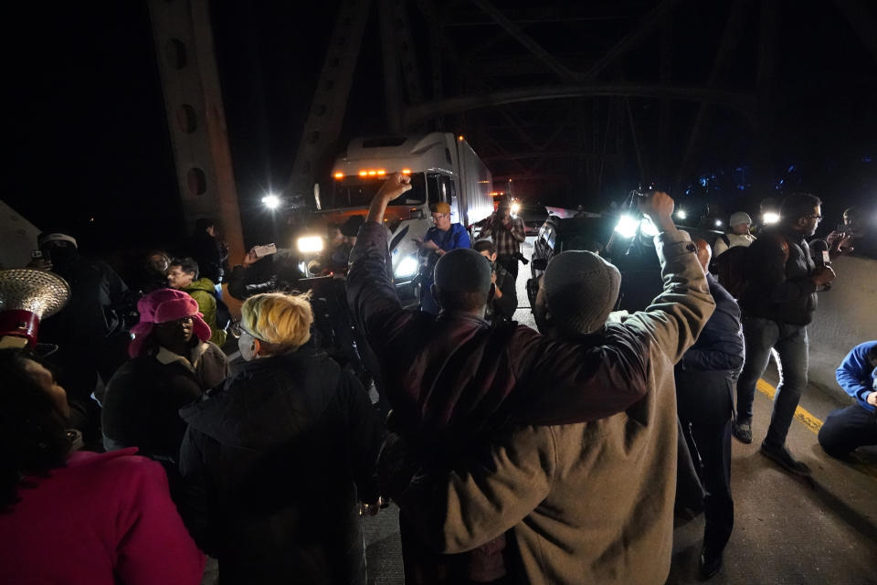 Protesters take over a bridge Friday, Jan. 27, 2023, in Memphis, Tenn., as authorities release police video depicting five Memphis officers beating Tyre Nichols, whose death resulted in murder charges and provoked outrage at the country's latest instance of police brutality. (AP Photo/Gerald Herbert)