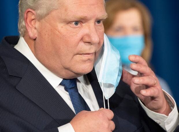 Ontario Premier Doug Ford, along with Solicitor General Sylvia Jones, told reporters Friday stricter measures are necessary because of a lack of vaccine supply. However, health experts have repeatedly said vaccines alone cannot stop the surge of the virus.  (Frank Gunn/The Canadian Press - image credit)