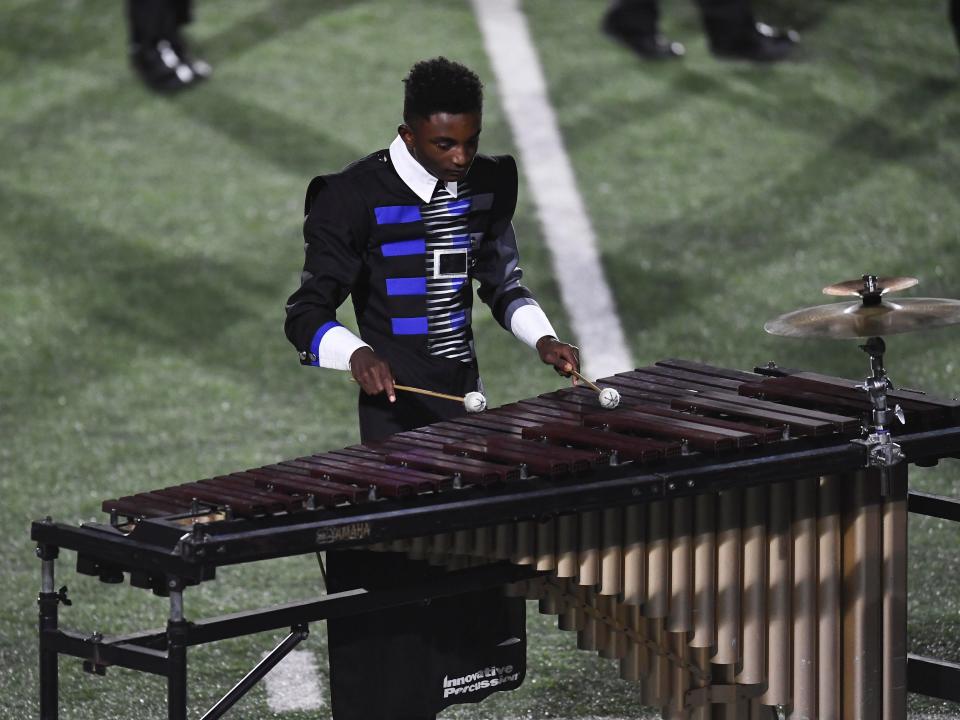 The show features an elaborate percussion section on the sideline.