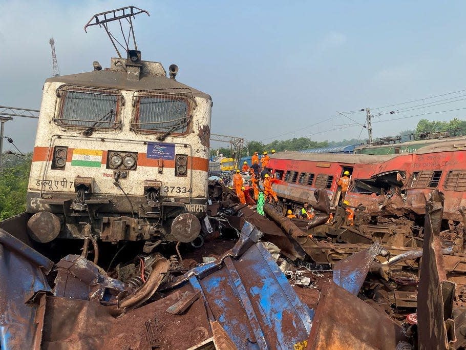 Damaged carriages are seen at the accident site of a three-train collision near Balasore.