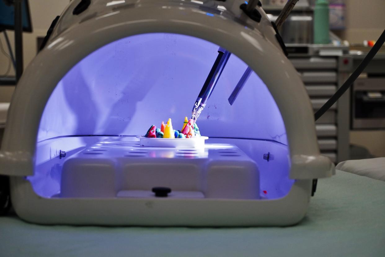 A doctor demonstrates robotic surgical equipment at OhioHealth Pickerington Methodist Hospital during a community open house held Saturday, Dec. 2, 2023.