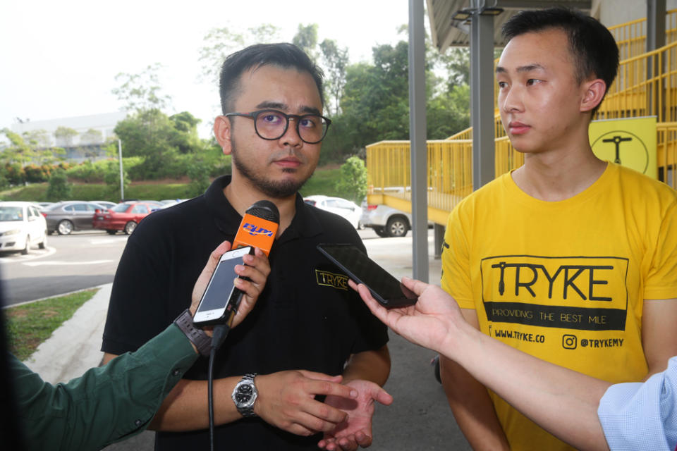 E-scooter sharing service Tryke's co-founder Shazwan Abdul Razak (left) and founder Timothy Wong speak to reporters at RekaScape in Cyberjaya November 22, 2019.