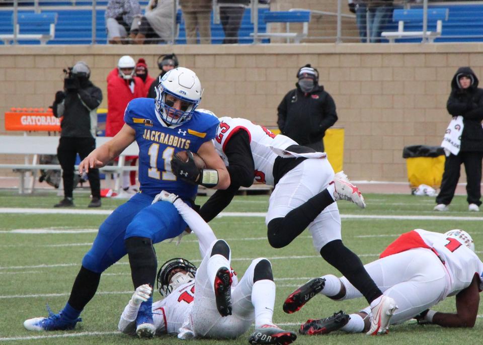 SDSU quarterback Mark Gronowski is tackled at the end of a run Saturday at Dana J. Dykhouse Stadium.