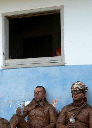 Members of a rescue team react upon returning from the mission, after a tailings dam owned by Brazilian mining company Vale SA collapsed, in Brumadinho, Brazil January 28, 2019. REUTERS/Washington Alves