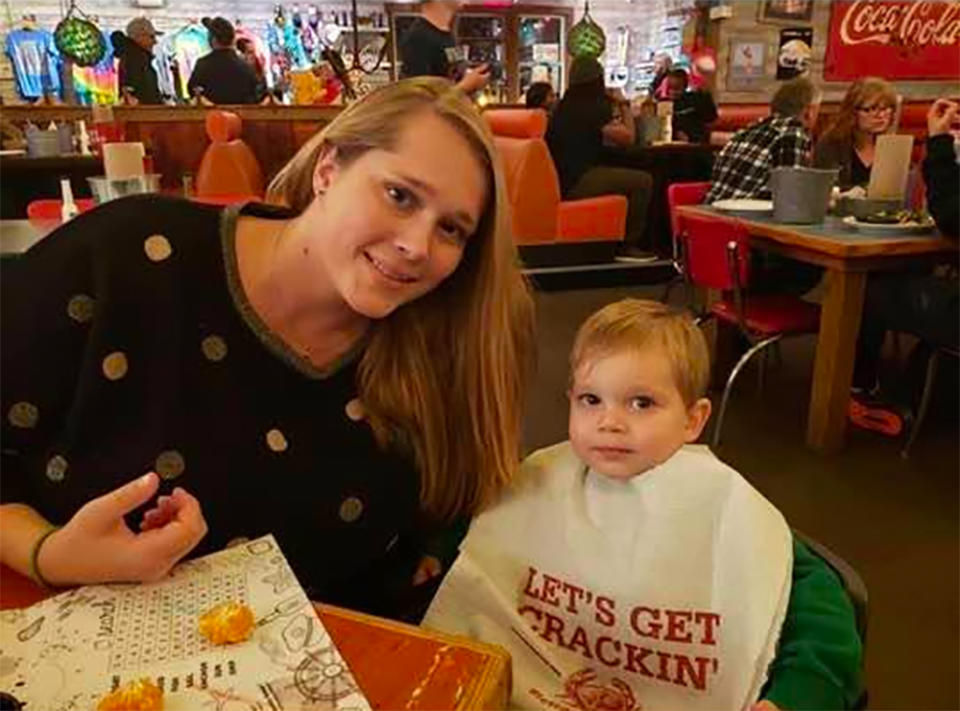 Shana Pringle sits with her son Noah in a restaurant.